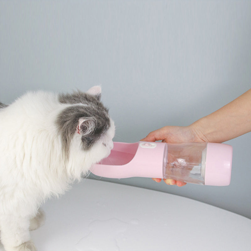 Teal Winterberry portable pet food and water bottle with built-in bowl for convenient feeding on the go.