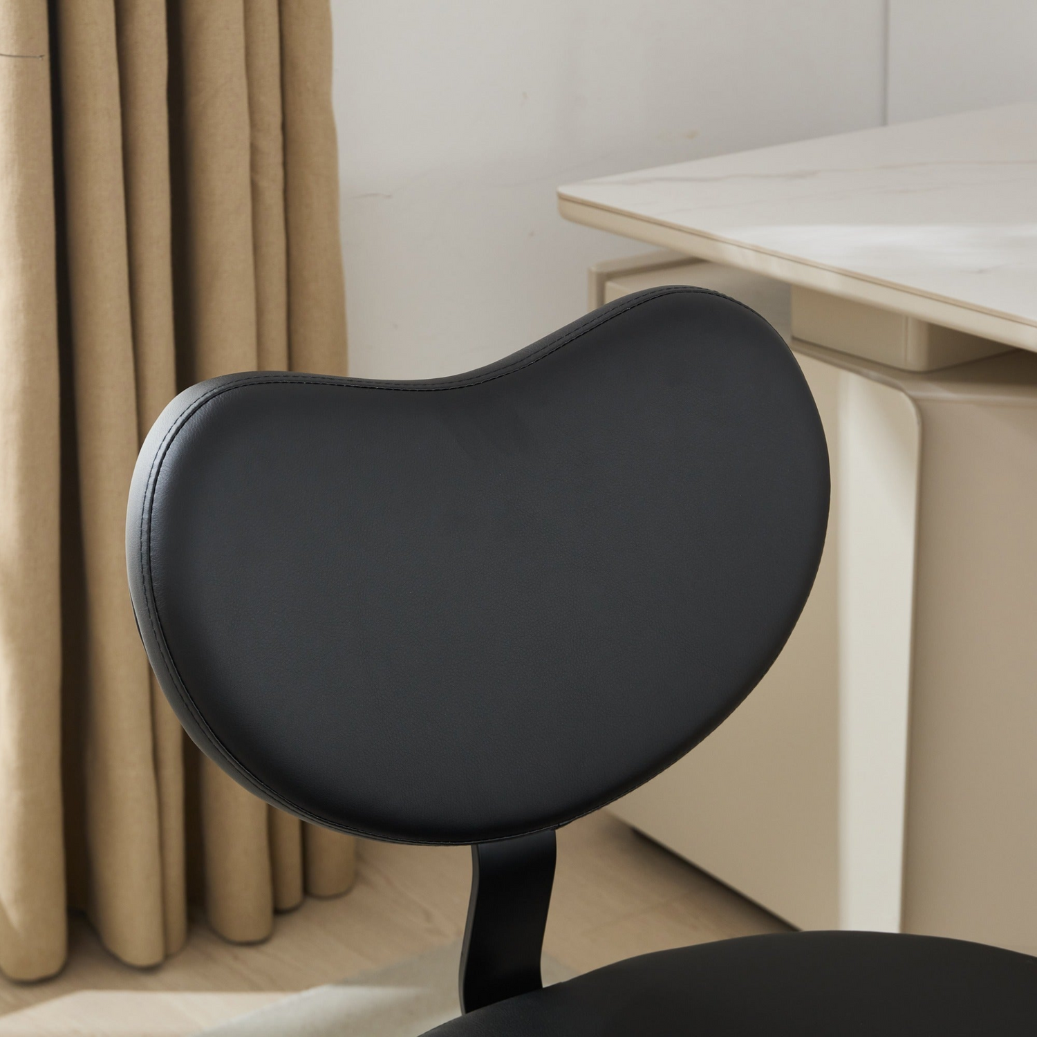 Black PU leather office chair with USB port, swivel function, and ergonomic design for home office or vanity desk.