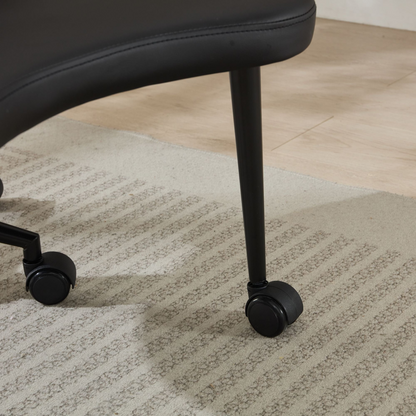 Black PU leather office chair by Start2Finish with USB port, power access, and swivel function, suitable for home office or vanity desk.