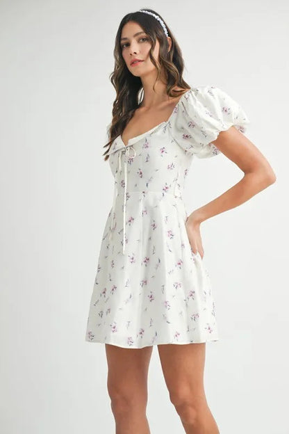 Pear Daisy floral print puff sleeve mini dress with a feminine design, perfect for home and garden occasions.