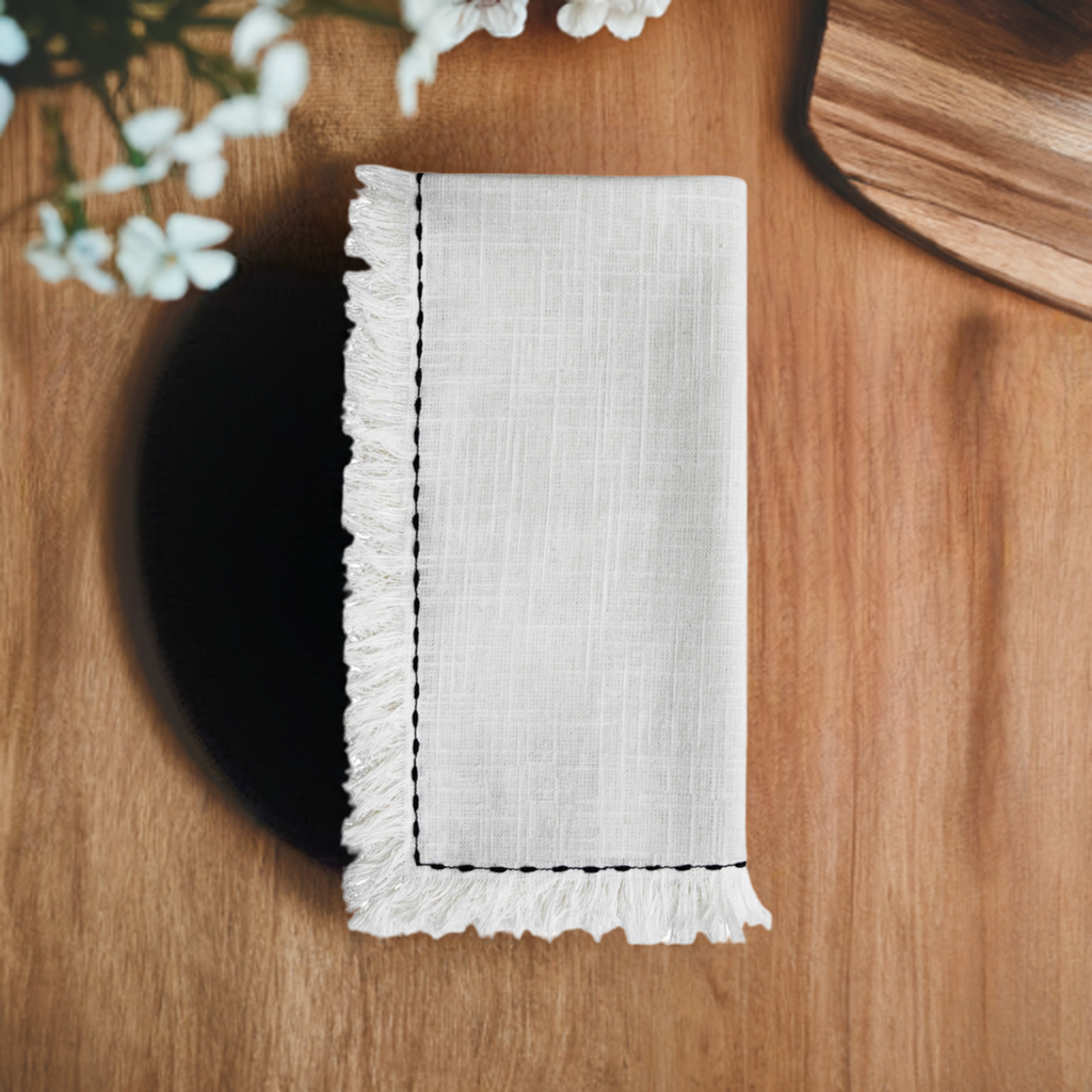 Set of four white home table cloth napkins with black embroidery from Start2Finish, showcasing elegant stitching and decorative design.