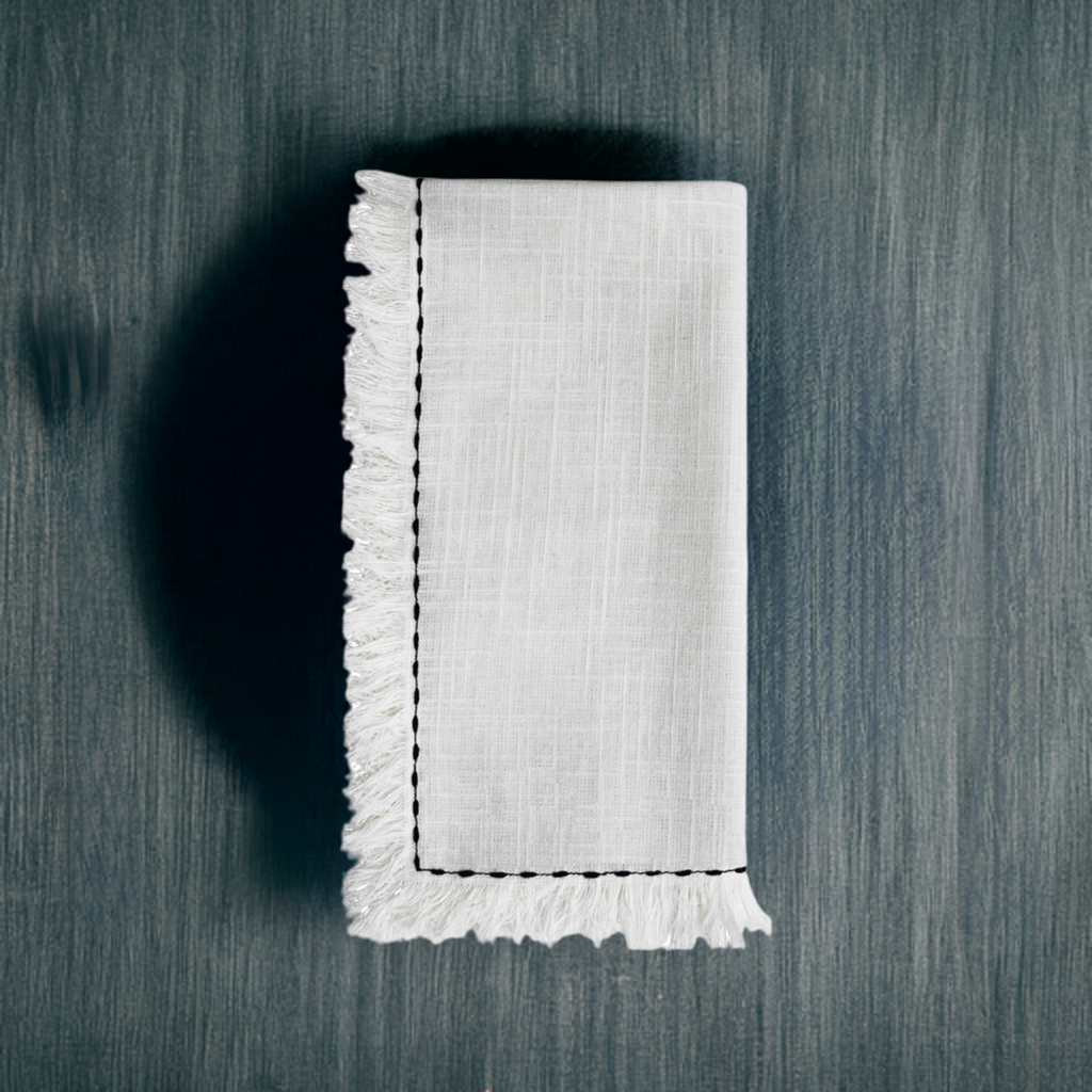 Set of four Start2Finish home table cloth napkins with elegant black embroidery, showcasing detailed stitching and soft fabric.