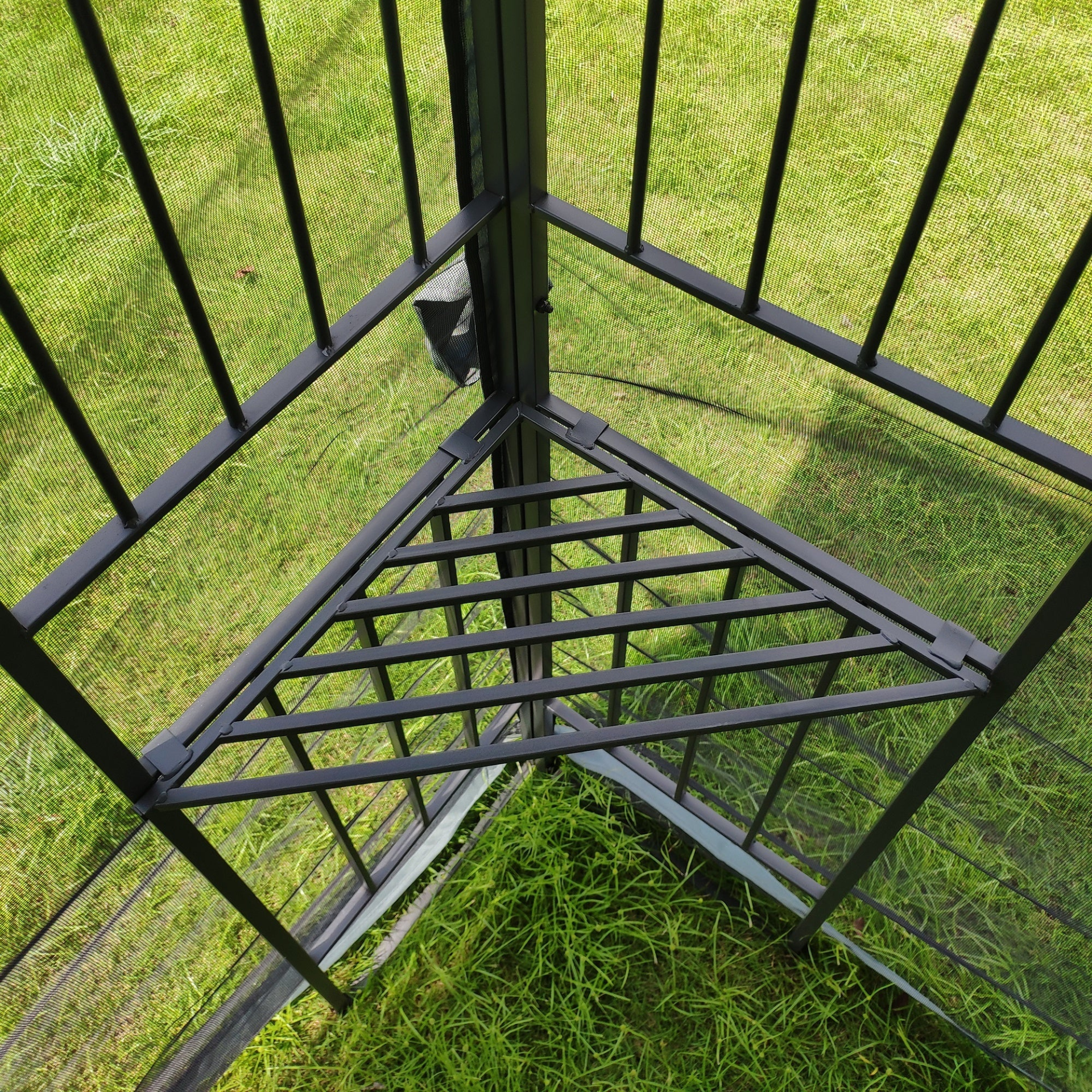 Gray metal outdoor gazebo canopy with roof, side panels, and storage for patio and outdoor living by Start2Finish.