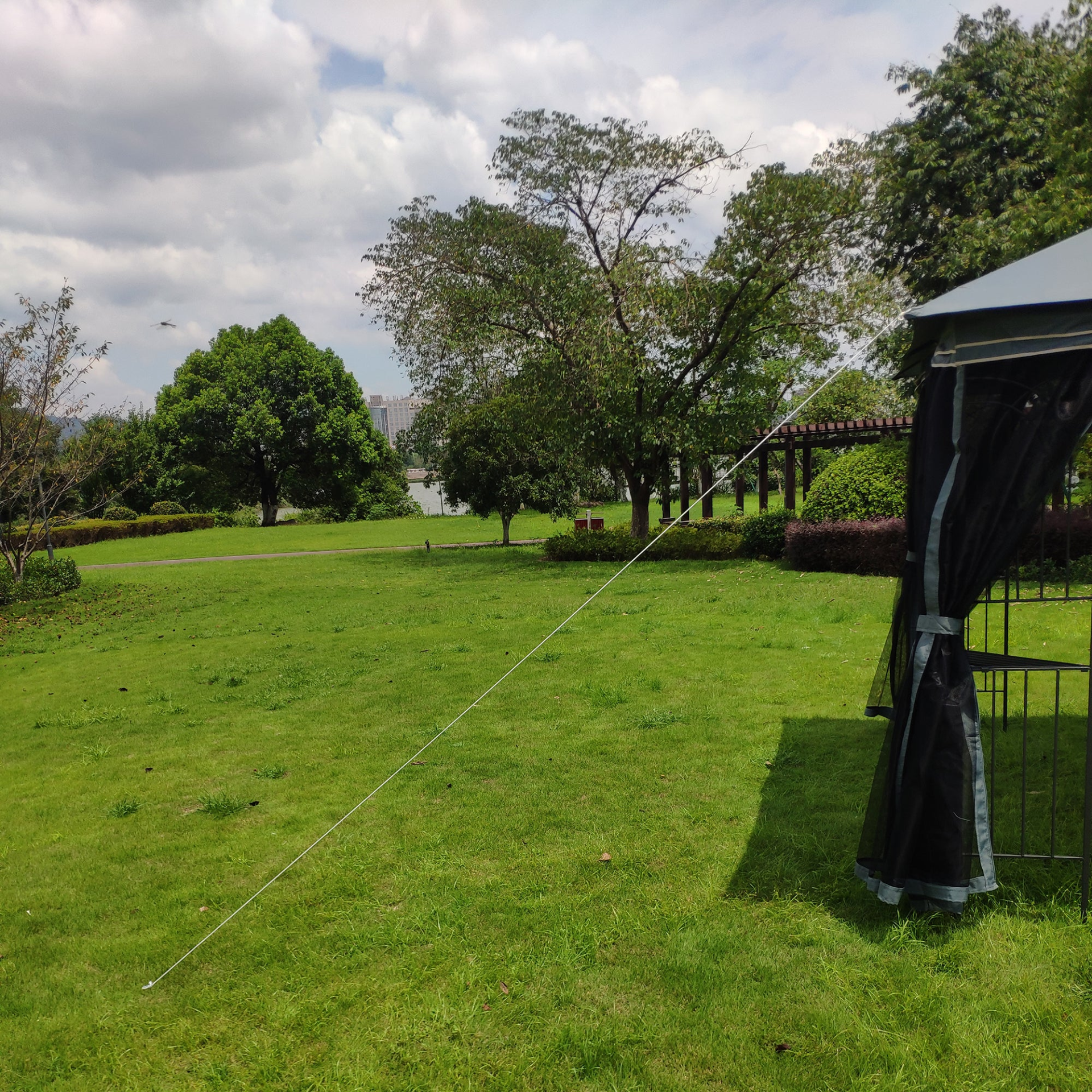 Gray metal outdoor gazebo canopy with roof and storage, ideal for patio and outdoor living spaces by Start2Finish.