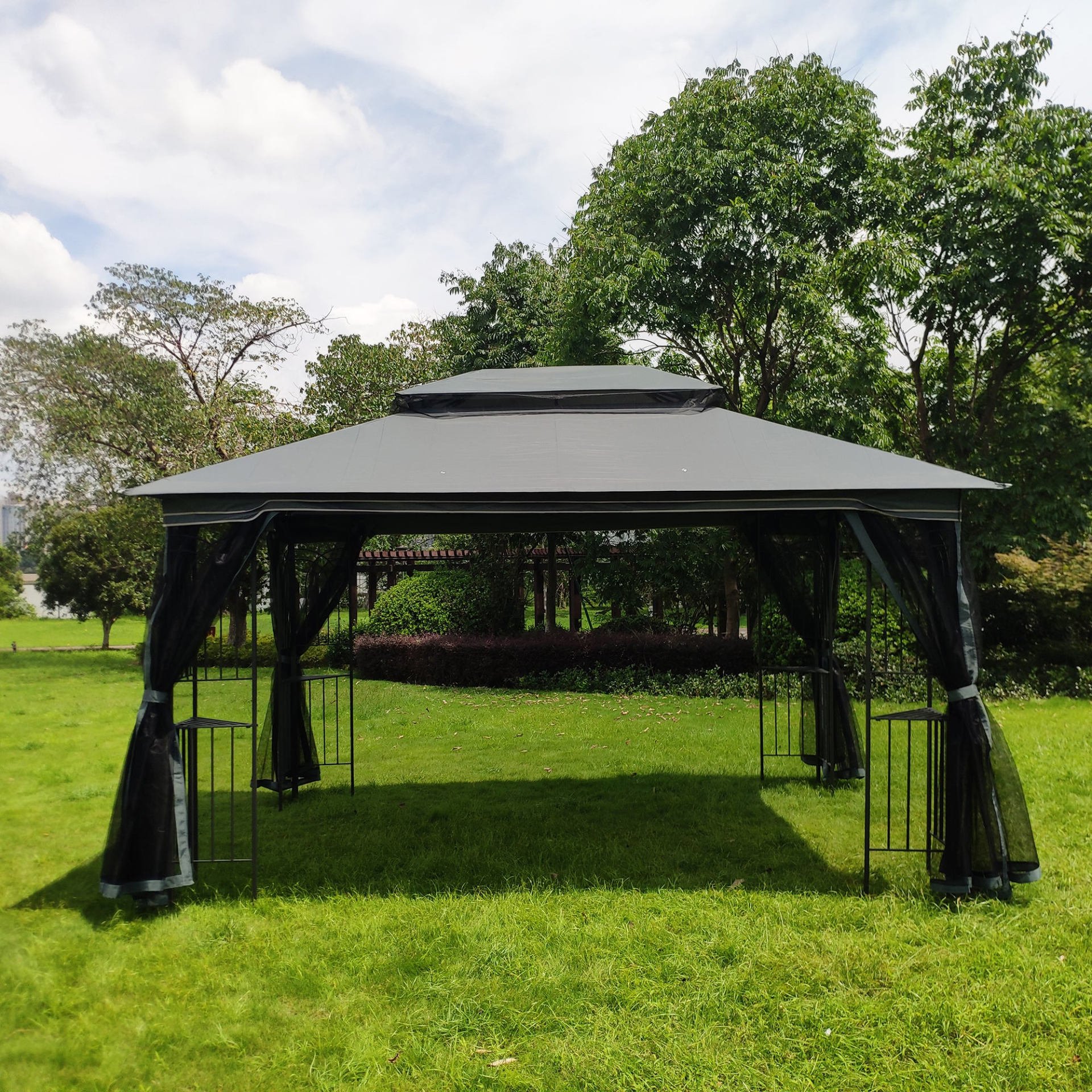 Gray metal outdoor gazebo canopy with roof and storage, ideal for patio and outdoor living spaces.