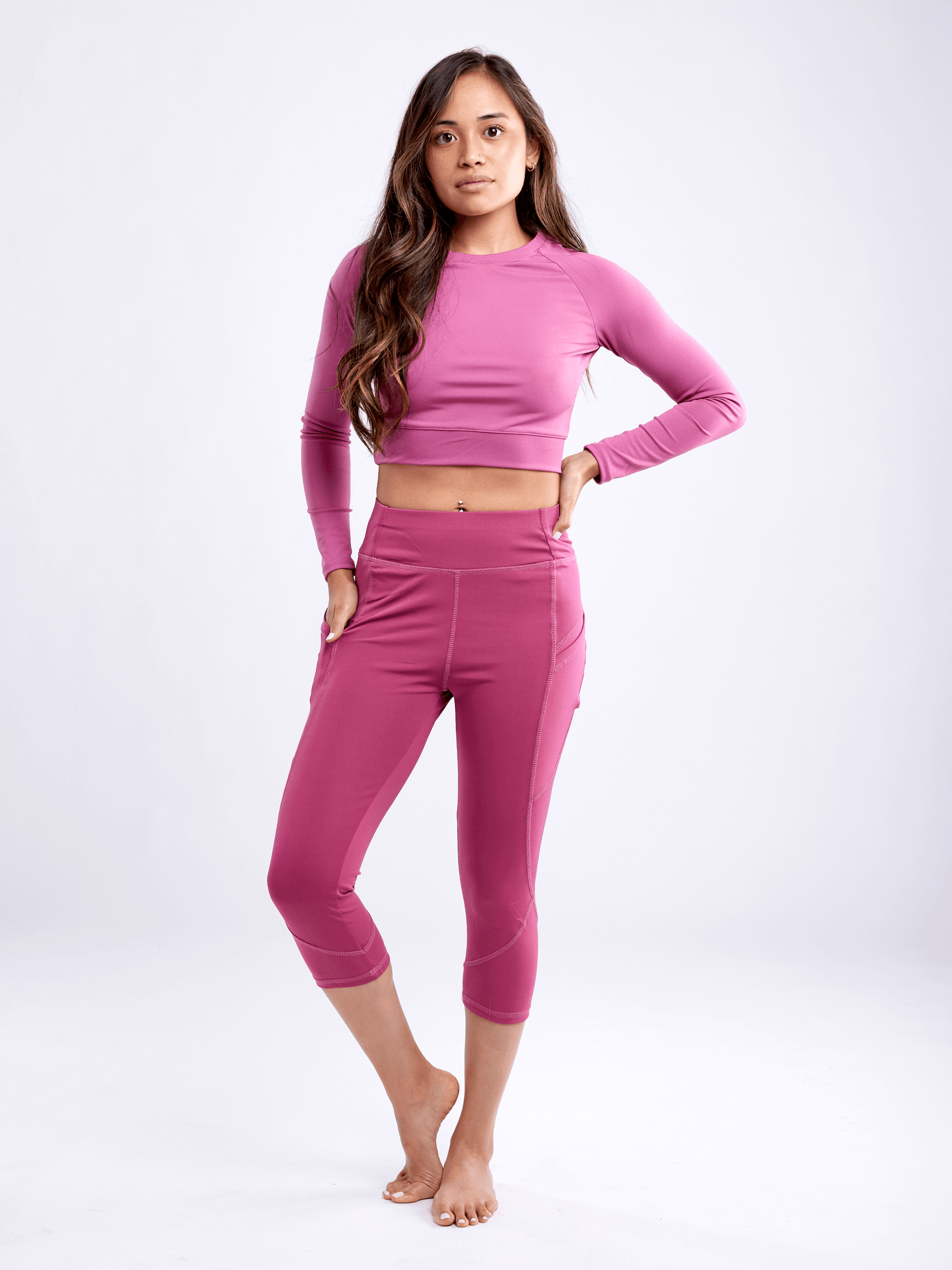 Black Lavender JupiterGear long-sleeve crop top, activewear with a fitted design and stylish neckline, shown on a model.