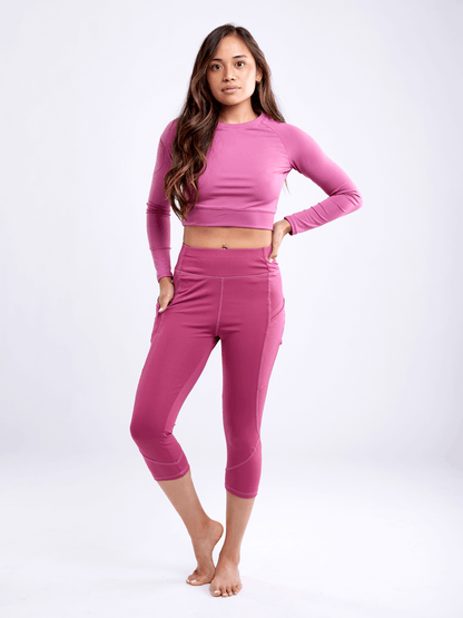 Black Lavender JupiterGear long-sleeve crop top, activewear with a fitted design and stylish neckline, shown on a model.