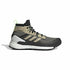 Black Adidas Terrex Free Hiker hiking boots for men, designed for camping and outdoor adventures, shown in a natural outdoor setting.