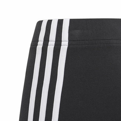 Black Adidas Essentials sports leggings with 3 stripes, designed for active wear and outdoor sports activities.
