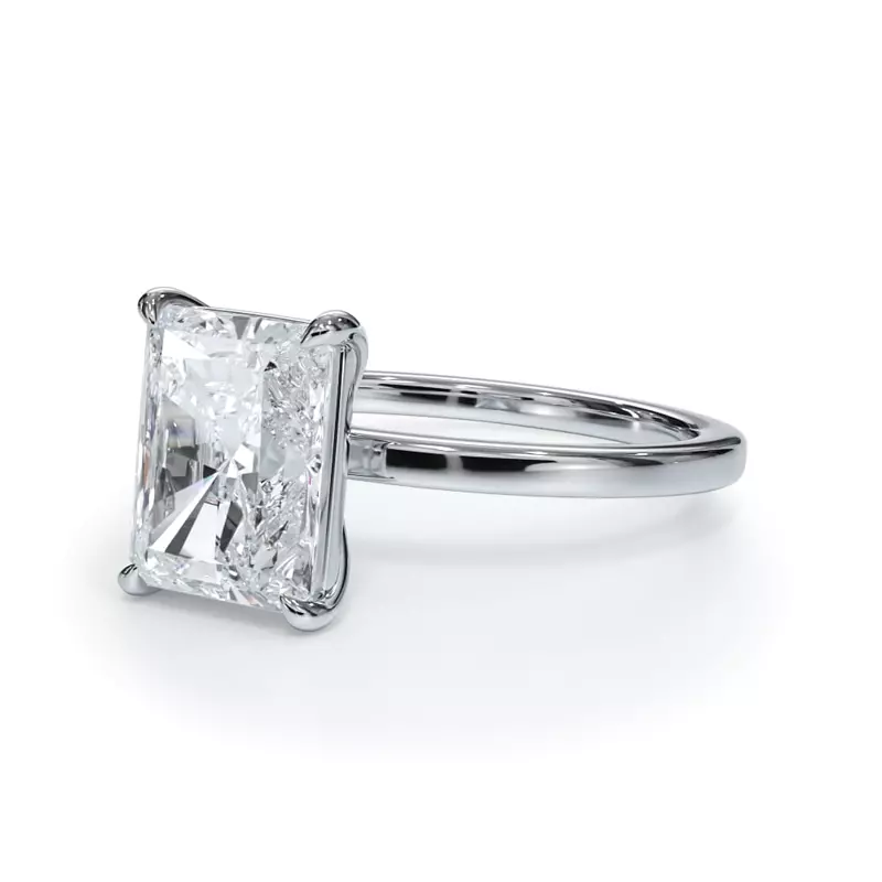 Lab grown 5.00 CTW emerald cut diamond solitaire engagement ring in 14K white gold with G color and VS clarity, IGI certified.