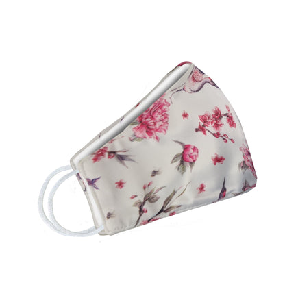 Pink birds and flowers face mask for women by Cyan Poppy, featuring a floral and bird pattern on fabric.