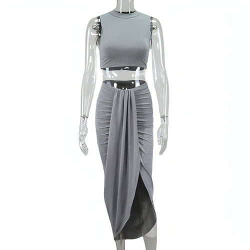 Medium length irregular vest dress by Carmine Juneberry featuring layered fabric and casual style, shown on a model.