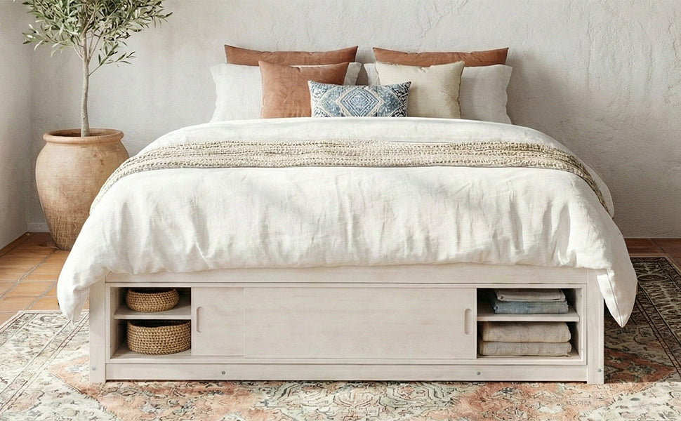 Solid wood platform bed frame with four storage drawers, footboard cubby, and headboard, ideal for bedroom or guest room.