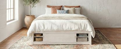 Solid wood platform bed frame with four storage drawers, headboard, footboard cubby, and MDF accents for bedroom or guest room.