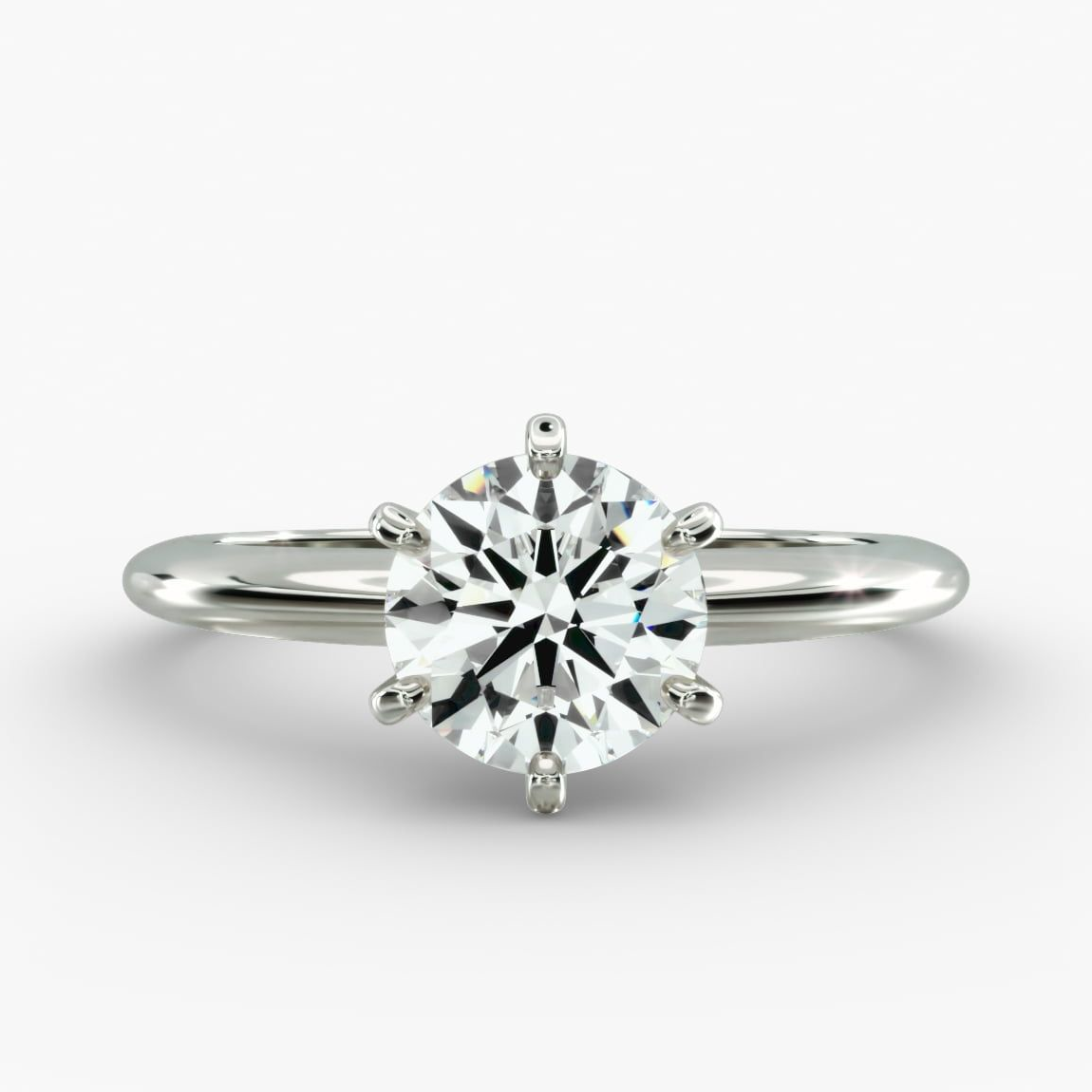 Round lab-grown diamond solitaire engagement ring with six prongs, F-VS clarity, set in 14K white gold.