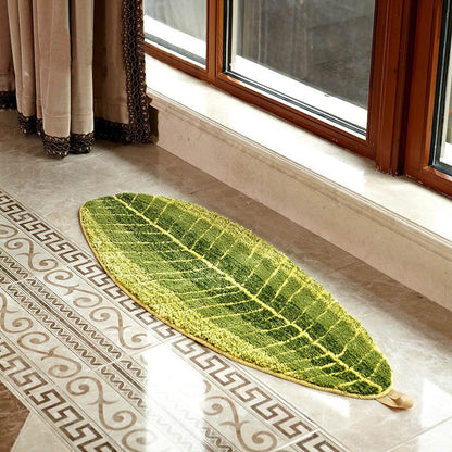Fuchsia Molly banana leaf patterned carpet for home decor, showcasing lush green banana leaves on a neutral background.