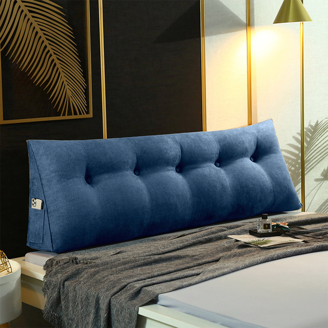 Blue triangular wedge bed pillow with headboard and backrest, designed for bedside decor and home comfort.