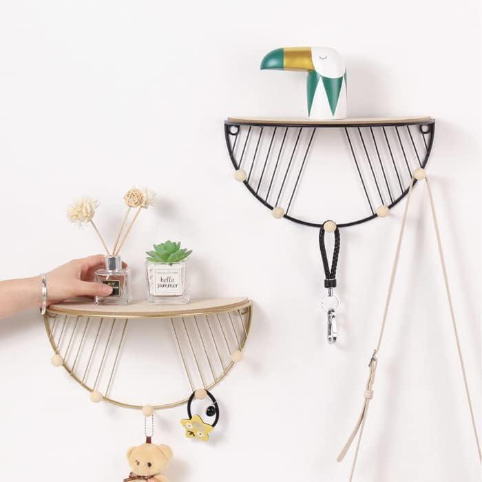 Golden D shape wall hooks with floating shelf and wooden hooks for home organization by Carmine Athena.