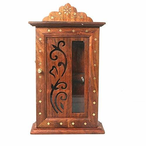 Sheesham wood wall-mounted key holder with leaf design and hooks, used for home decor and organization.