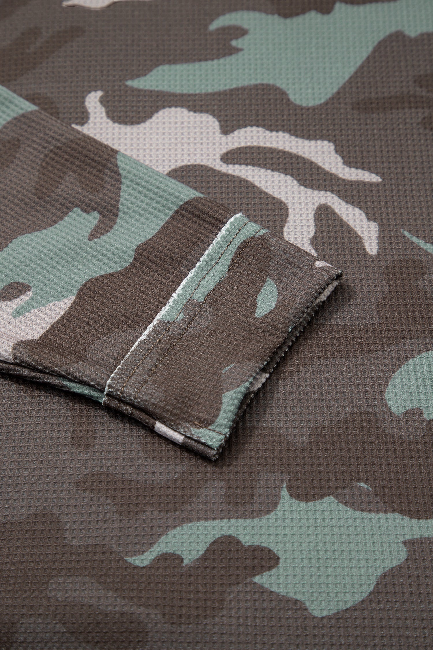 Camo textured drop shoulder long sleeve top by Byzantium Bay, featuring a relaxed fit and stylish camo pattern.