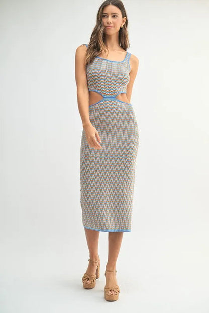 Pear Daisy MABLE multi-color chevron knit bodycon midi dress displayed on a model, featuring vibrant patterns and a fitted silhouette.