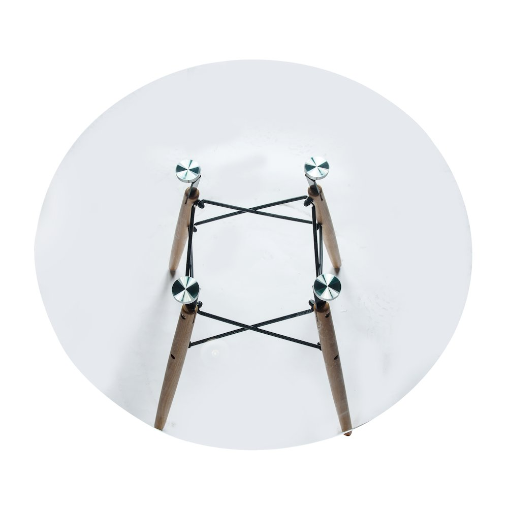 Dover round bistro glass top dining table with natural wood Eiffel base by Start2Finish, showcasing a modern furniture design