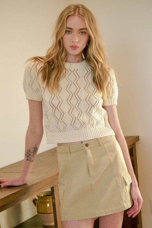 Jade Icarus Mittoshop Cargo Mini Skirt with side pockets, shown in a stylish automotive-themed design, featuring a modern mini length.