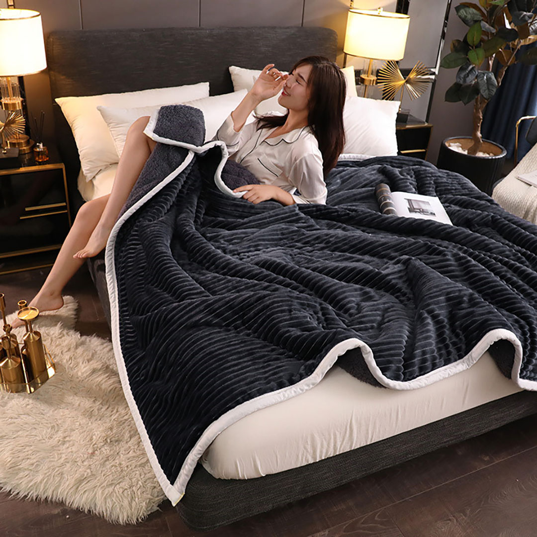 Black SOGA throw blanket by Start2Finish, soft and cozy home accessory, shown folded on a neutral background.