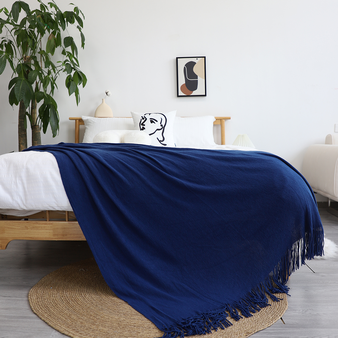 Royal blue acrylic throw blanket from SOGA by Start2Finish, shown draped over a sofa for cozy home decor.