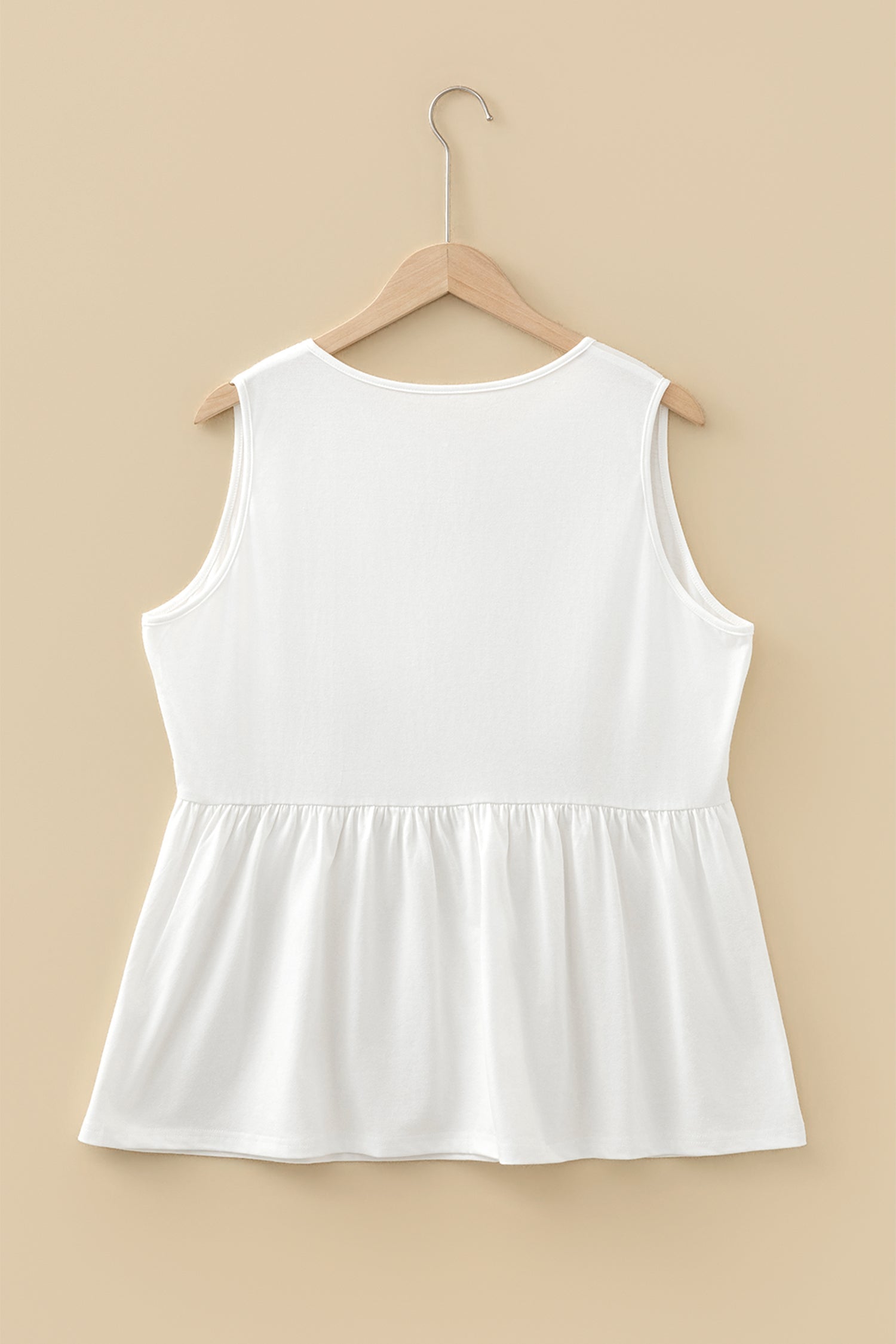 Plus size solid bow-tie peplum tank top for women by Byzantium Bay, featuring a stylish bow detail and flattering fit.