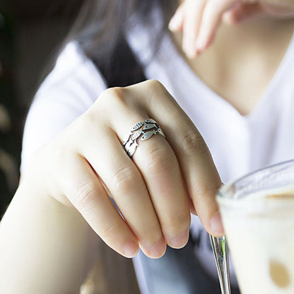 Silver fish ring by Fuchsia Molly featuring a sleek, detailed fish design on a polished band for stylish jewelry.