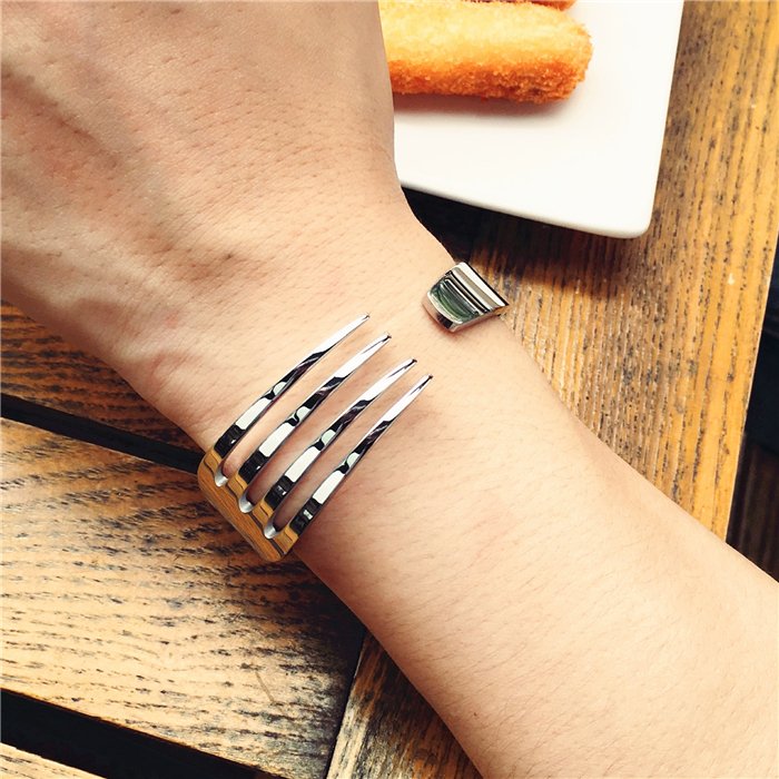 Fuchsia Molly fork bracelet featuring a unique metal fork design, stylish jewelry accessory for everyday wear.