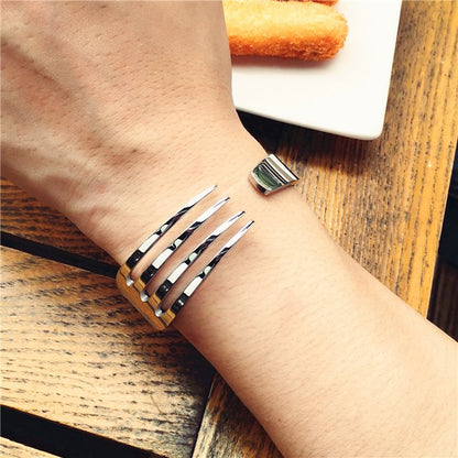 Fuchsia Molly fork bracelet featuring a unique metal fork design, stylish jewelry accessory for everyday wear.