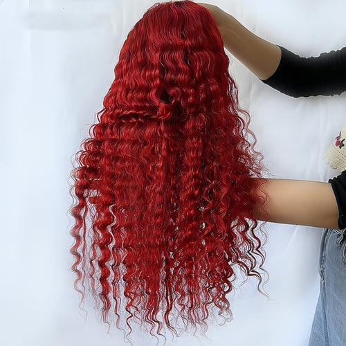 Red deep wave human hair wig by Carmine Juneberry styled on a mannequin head for natural hair look and volume.