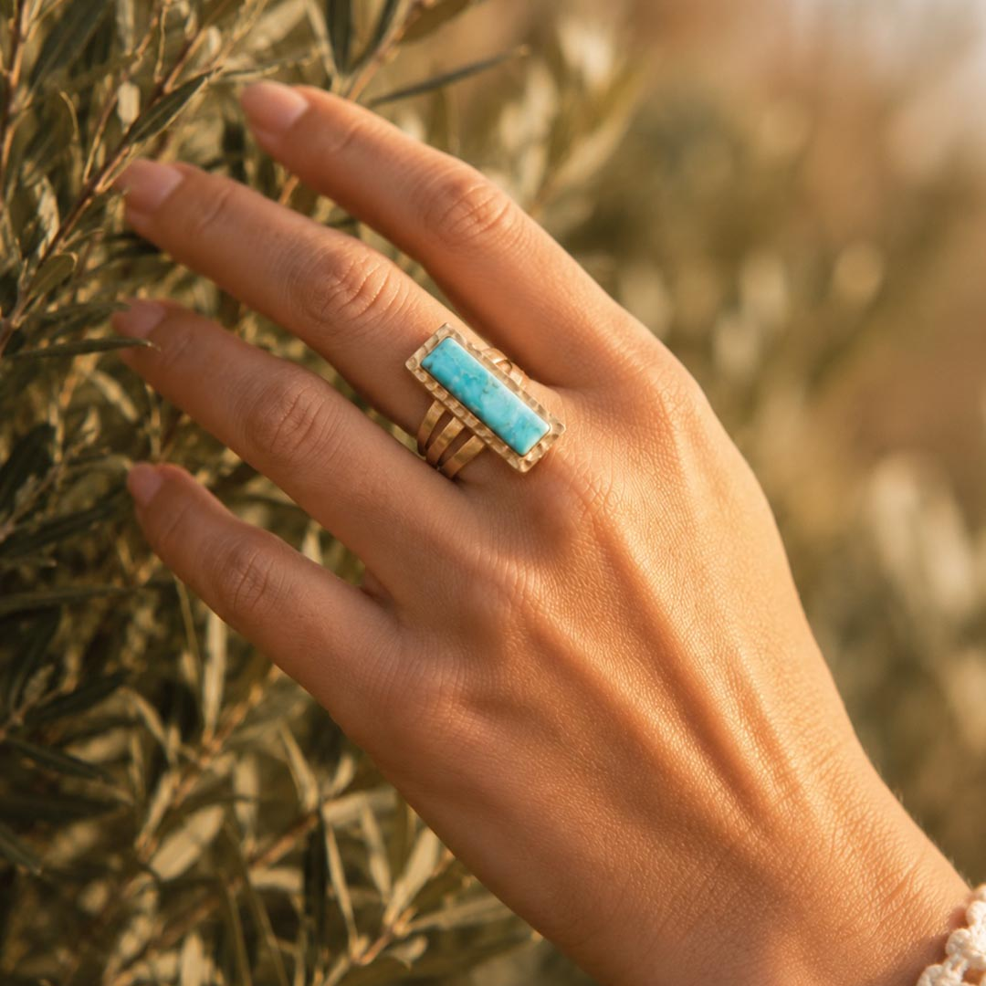 Aztec blue turquoise and gold statement ring from Start2Finish, featuring intricate design and bold jewelry style.