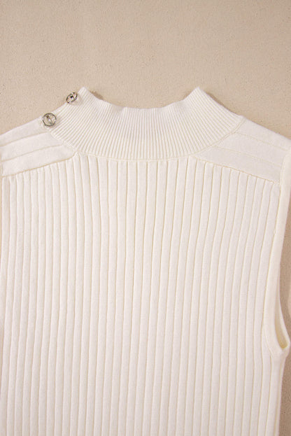 White ribbed knit high neck sweater vest by Carmine Juneberry, close-up of the textured fabric and high neckline.