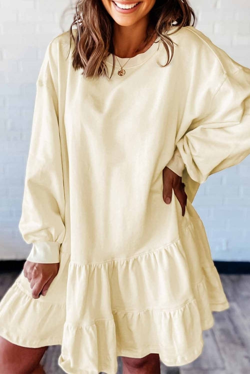 Byzantium Bay solid long sleeve dress with tiered ruffle hem, featuring a stylish and feminine design.