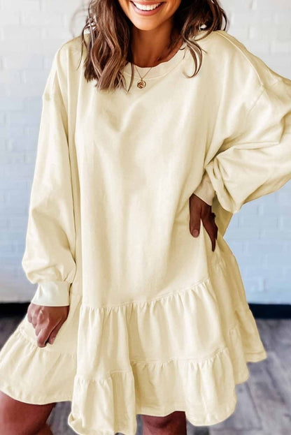 Byzantium Bay solid long sleeve dress with tiered ruffle hem, featuring a stylish and feminine design.