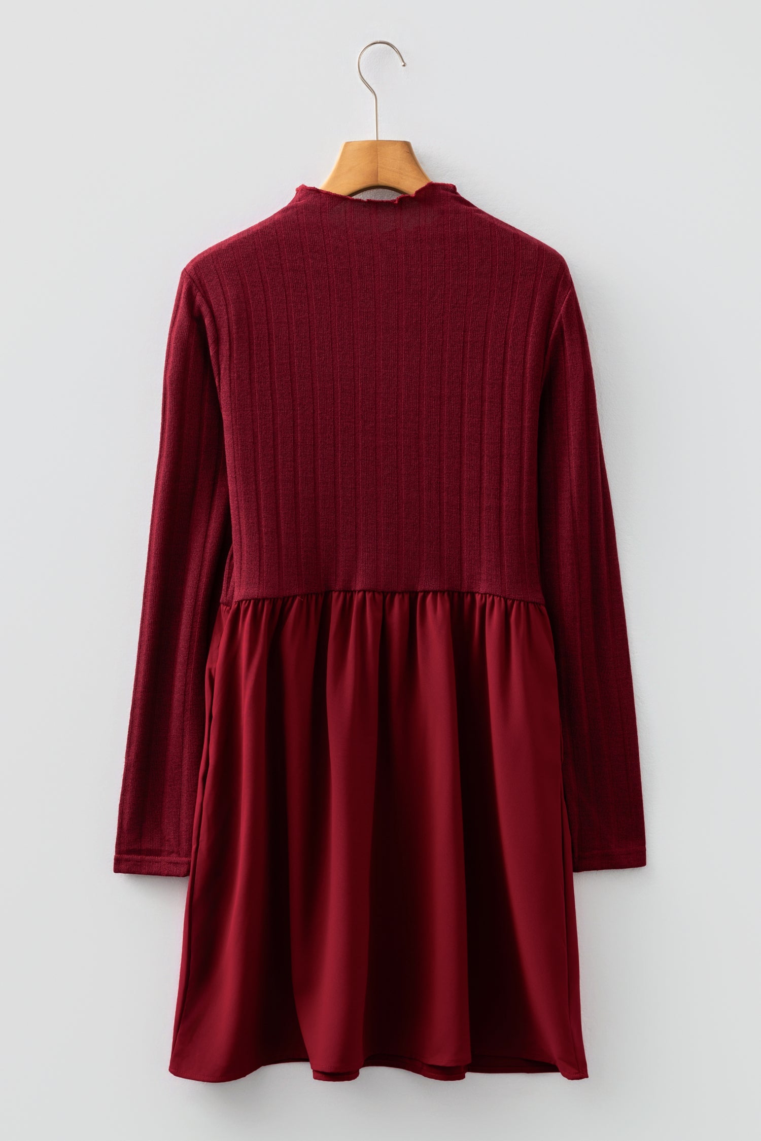Byzantium Bay ribbed knit patchwork long sleeve dress with textured fabric and stylish design, shown on a model.