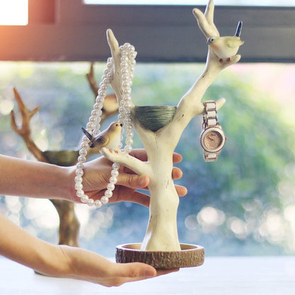 Fuchsia Molly Tree of Life jewelry holder with branches for organizing necklaces and bracelets, made of metal with intricate design.