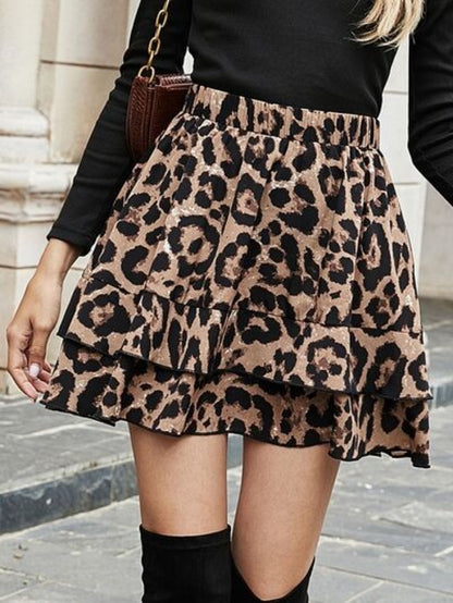 Taupe Oliver MUNSIEUR leopard print ruffled skirt with animal pattern and flowing ruffle detail, stylish luxury fashion piece.