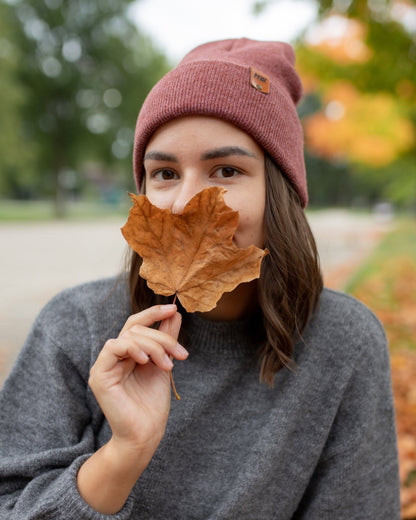 Azure Arrowwood HAAKWEAR knit cuffed beanie in rusty burgundy, featuring a cozy, textured knit hat style and snug cuff design.