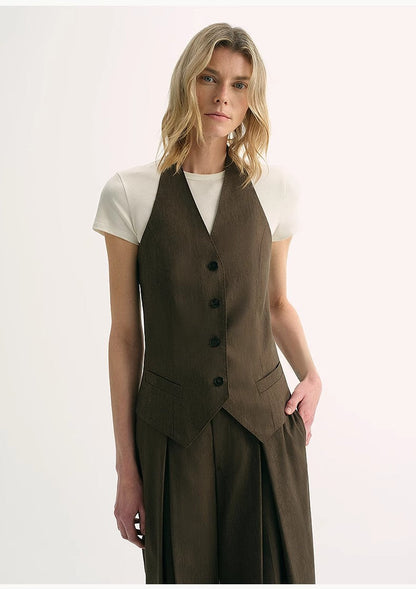 Brown Coeus silk linen halterneck sleeveless jacket with a classic old money style, featuring a cool, sophisticated design.