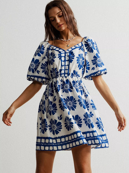 Floral print puff sleeve mini dress by Pear Daisy, featuring a stylish design with vibrant floral patterns and puffed sleeves.