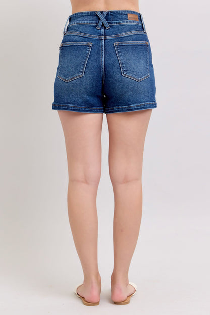 Judy Blue plus size denim shorts with double button waistband, featuring a classic denim design and visible stitching.