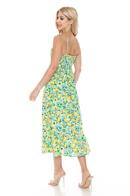 Women’s floral maxi dress by Jade Icarus featuring a flowy silhouette and vibrant flower pattern, perfect for summer wear.