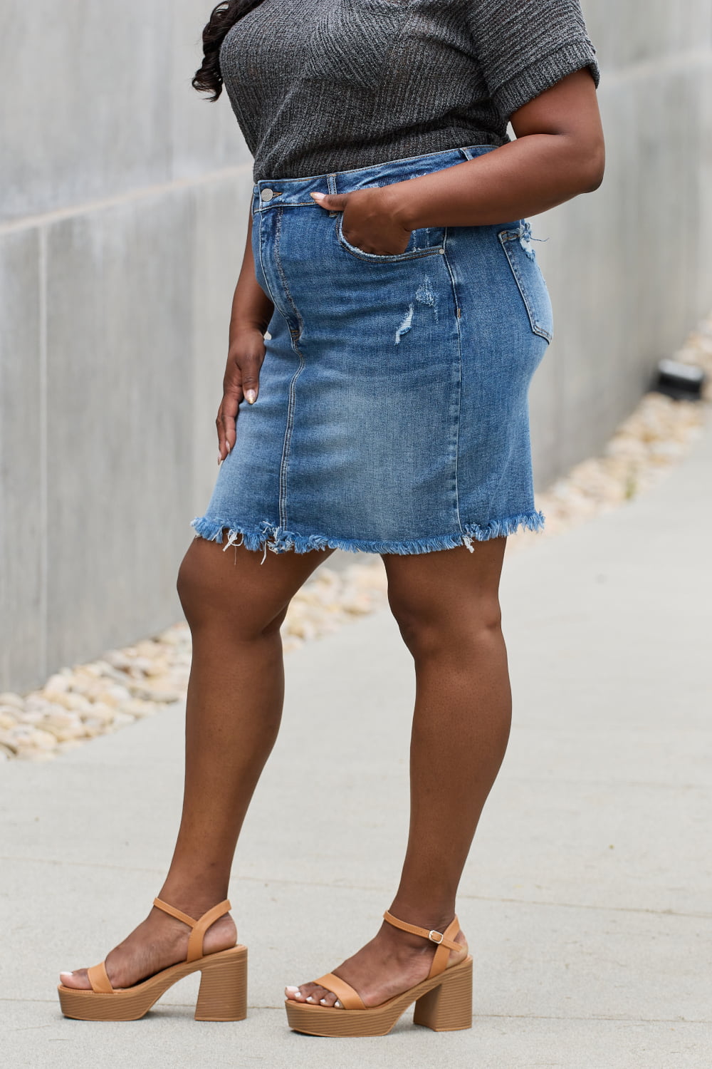 Jade Icarus RISEN Amelia full-size denim mini skirt with automotive-inspired design details, photographed on a plain background.