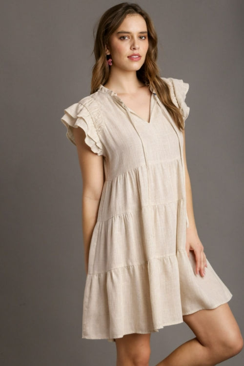 Plus size Umgee linen A-line tiered mini dress for women by Jade Icarus, featuring a full-length, flowy design and tiered detailing.