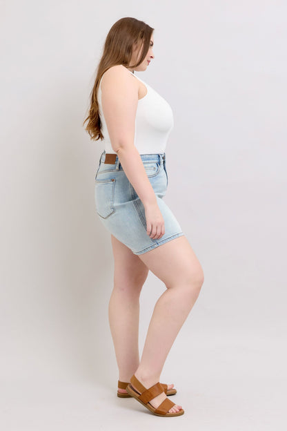Judy Blue plus size denim shorts with two buttons and front pockets, styled as women&