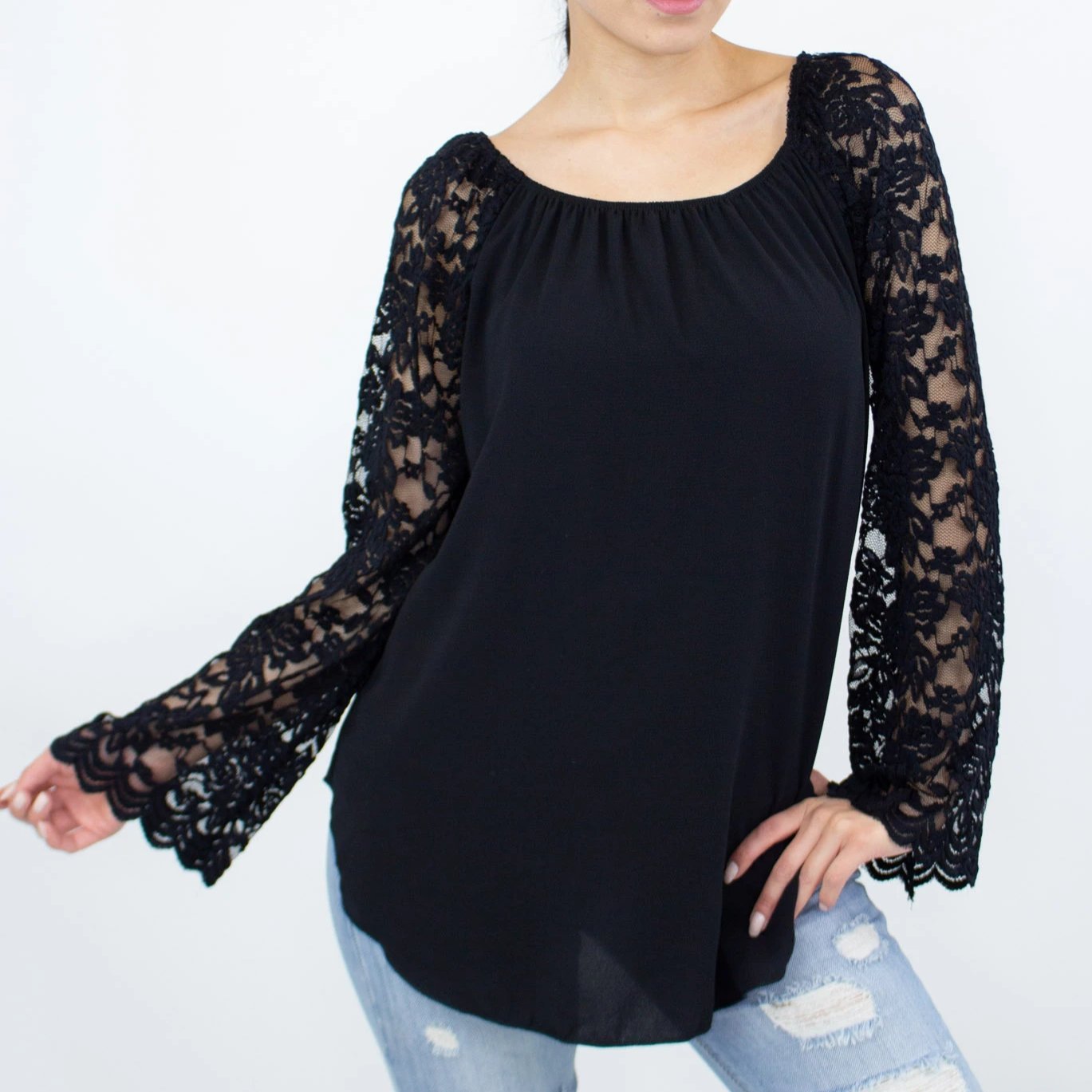 Black lace sleeve backless top from Yellow Hera, stylish blouse with elegant lace detailing and open back design.